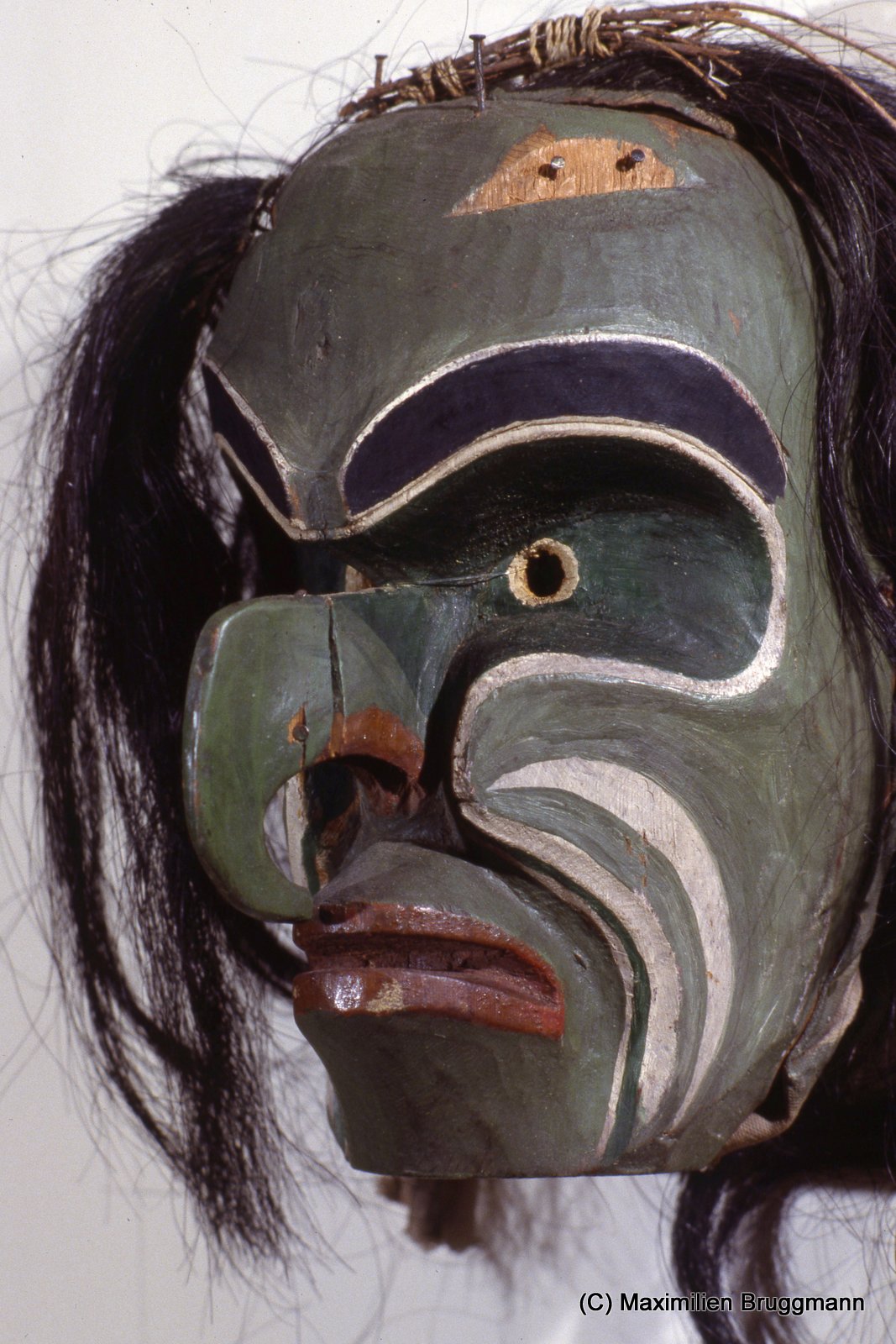 p135. The Lekwiltok Kwakiutl mask represents Bookwus, the wild forest monster.The animal-like earsare missing from the forehead. Confiscated 1n 1922, along with other potlatch goods, the mask was returned 1n 1979 to the new Kwakiutl museum in Quathiaski Cove, located on Quadra Island, British Columbia.